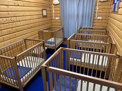Kiddies' Cabin Sleep room with empty cots
