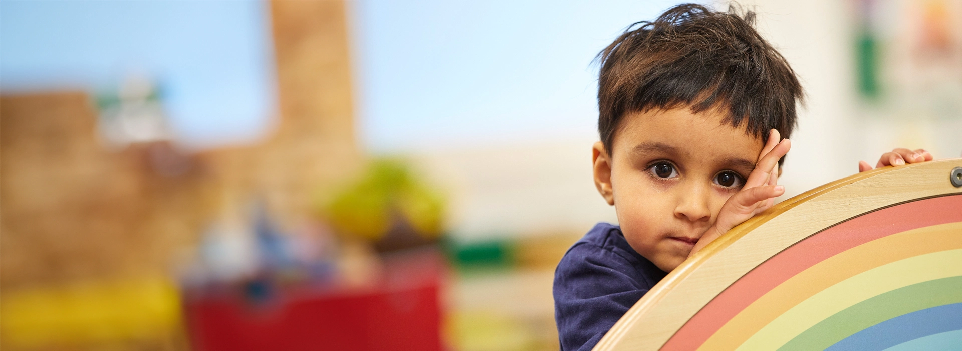 Boy With Rainbow Arch