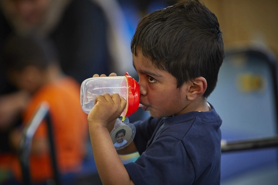 Nursery child drinking
