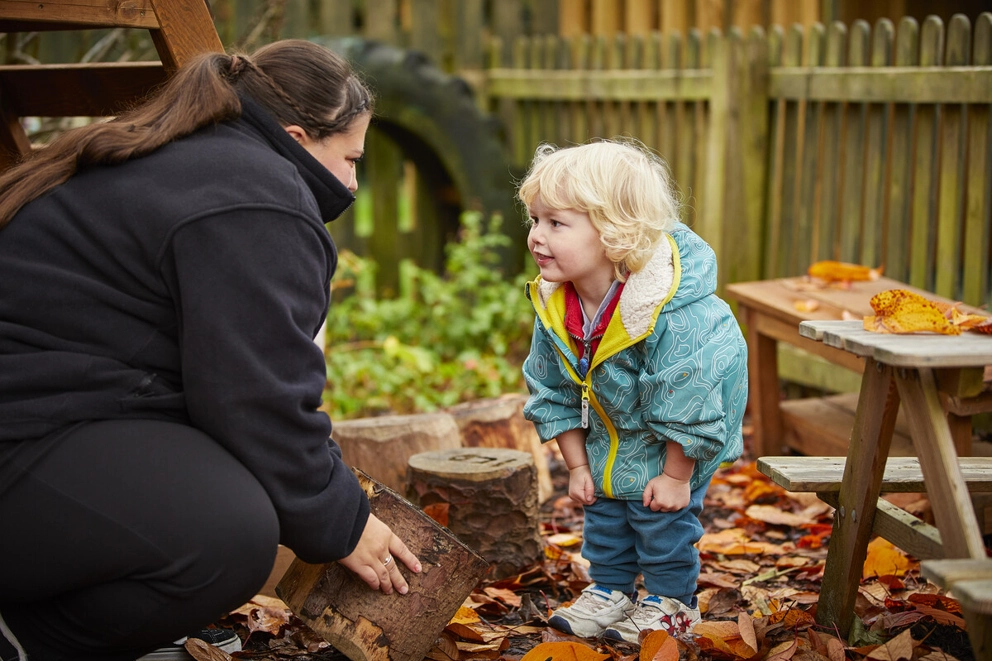Nursery Staff with Toddler playing outside